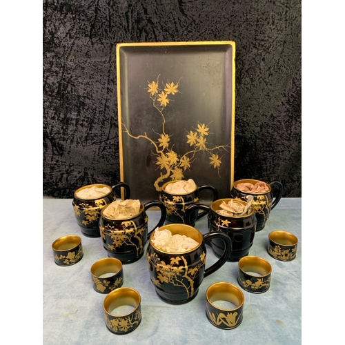 41 - Oriental / Japanese boxed set of lacquerware drinks tankards with tray and napkin rings, all beautif... 