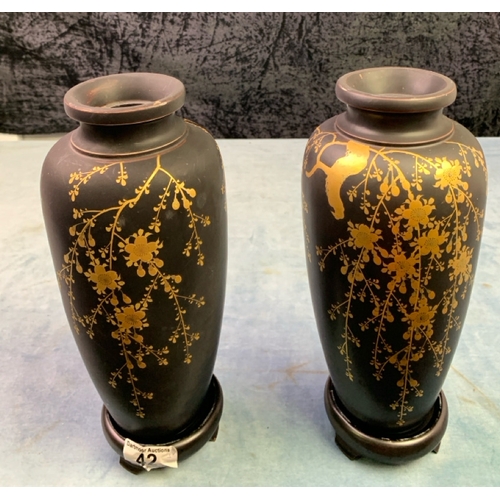 42 - Pair of Oriental / Japanese hand painted wooden vases on stands with hand painted gold detail