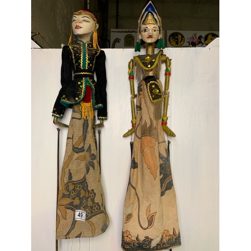 49 - Two Wayang Golek Indonesian stick puppets, approx 60cm tall
