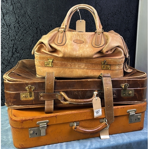 107 - Three pieces of vintage leather luggage including a small suitcase and holdall  by Etienne Aigner an... 