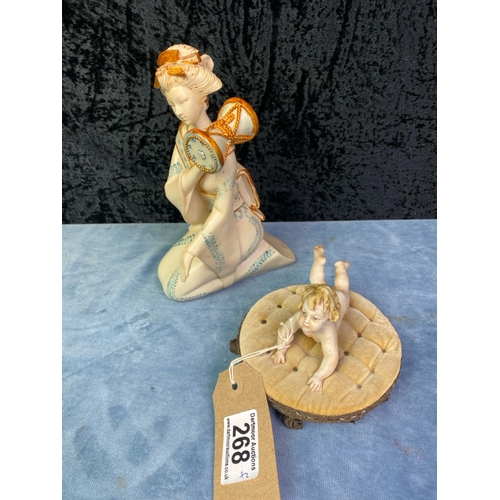 268 - Vintage Geisha Girl figurine cream with blue and gold detail H20cm together with a vintage Capodimon... 