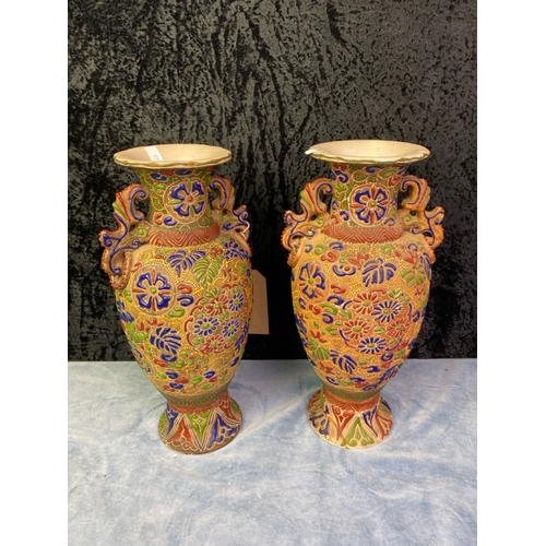 283 - A pair of elaborate Satsuma Moriage raised slipware vases with cobalt blue, ochre and sage detail H3... 