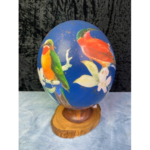 285 - Pretty decorated 'ostrich egg' on wooden  stand H20cm