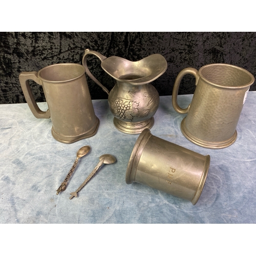 305 - A lovely 95% etain pewter pitcher with grape decorations along with English pewter tankards and some... 