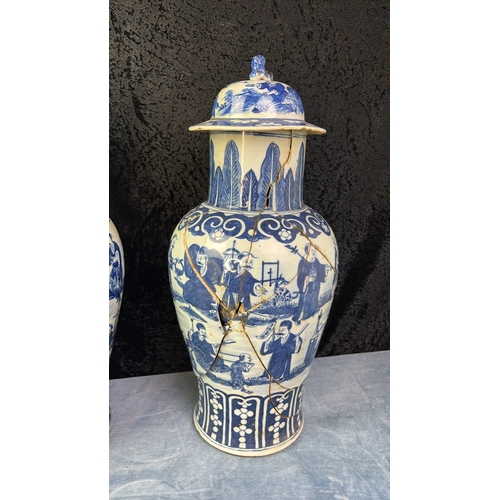 31 - Three Oriental / Chinese lidded blue and white hand painted urns / vases. Large pair are approx 47cm... 