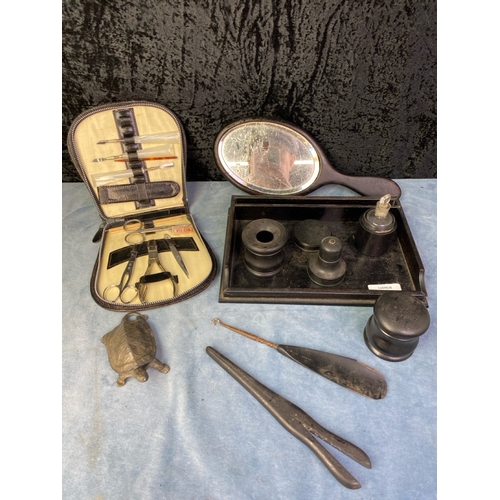 338 - Ebony dressing table set, a hand mirror, Two Tix manicure set and a metal tortoise