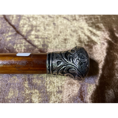 410 - Walking cane / stick with hallmarked silver top