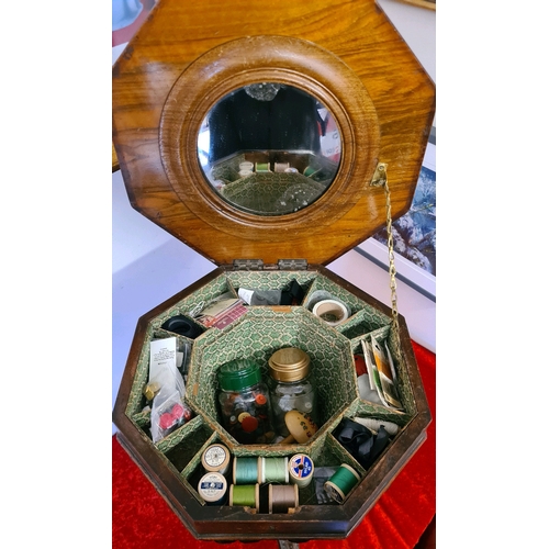 498 - Pedal sewing box table with carved legs, fitted interior with sewing contents (top of table a/f)