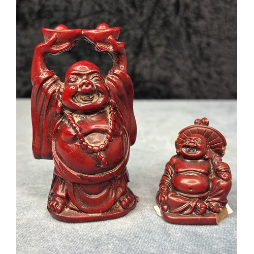 596 - Two Oriental Buddha figurines