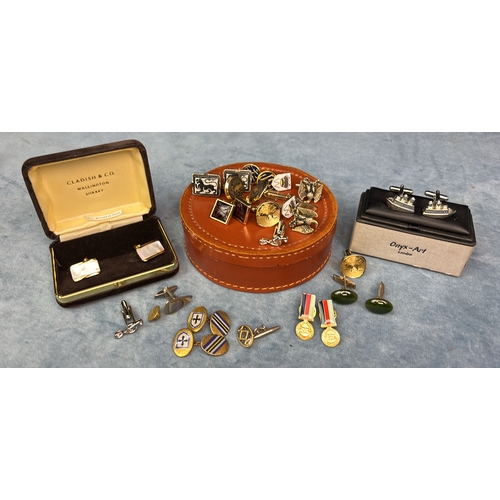 624 - Leather cufflinks box with a selection of cufflinks, a pair of boxed ship design cufflinks and a box... 