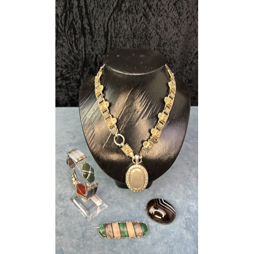 629 - Selection of white metal and agate stone jewellery including a panel necklace with locket, two brooc... 