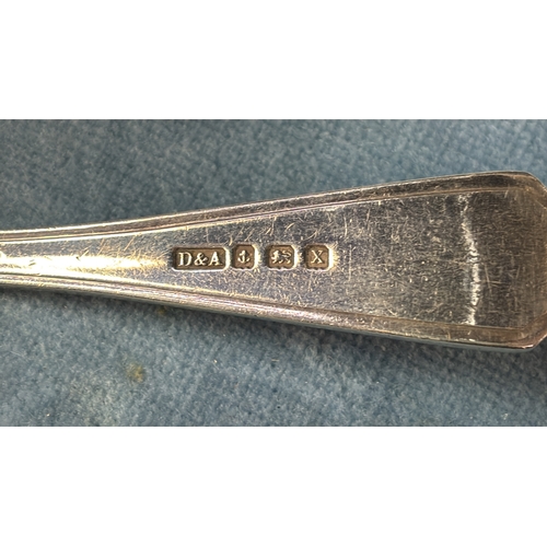 662 - Two silver spoons, scalloped spoon, Birmingham 1922 33g, the other Birmingham 1932, 19g