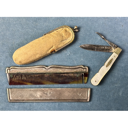 683 - Pretty little silver and mother of pearl fruit knife Sheffield 1902 and a small pocket comb with whi... 