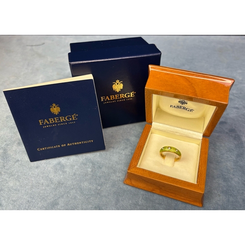 707 - Stunning 18ct gold Faberge ring with green brushed enamel decoration and set with 3 diamonds. Approx... 