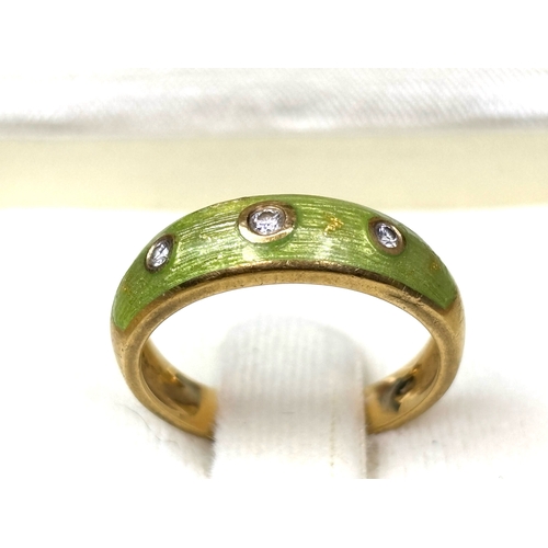 707 - Stunning 18ct gold Faberge ring with green brushed enamel decoration and set with 3 diamonds. Approx... 