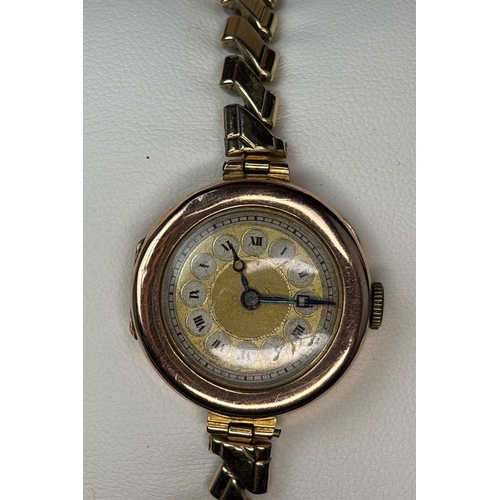 708 - Pretty 9ct gold ladies watch with Montal expanding bracelet type strap.