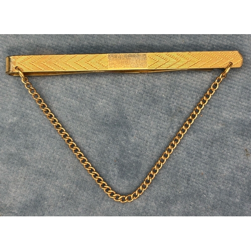 709 - Decorative 9ct gold tie pin. 7.84gms.