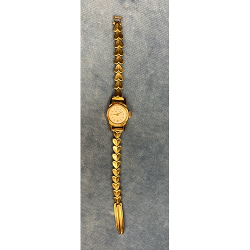 717 - Lovely 18ct gold ladies watch and 9ct gold bracelet with hearts. 13.9 gms total weight.