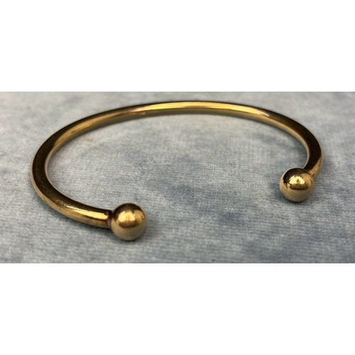 723 - Solid  9ct gold torque bangle. 24 gms.