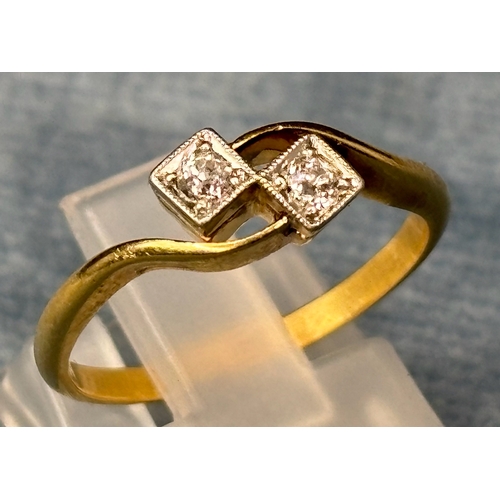 725 - Pretty 18ct gold ring with two diamonds. Size M. 2.4 gms total weight.