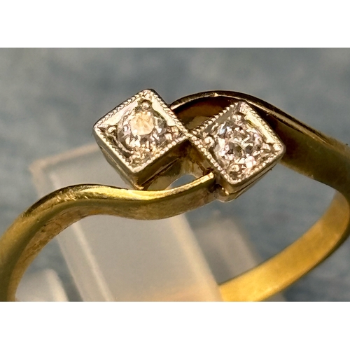 725 - Pretty 18ct gold ring with two diamonds. Size M. 2.4 gms total weight.