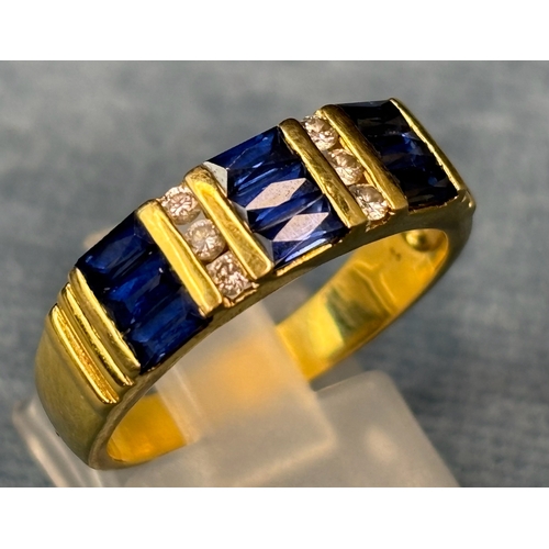 727 - Exquisite 18ct gold ladies ring set with 9 square cut sapphires and 6 diamonds. Size Q. 4.7gms. An a... 