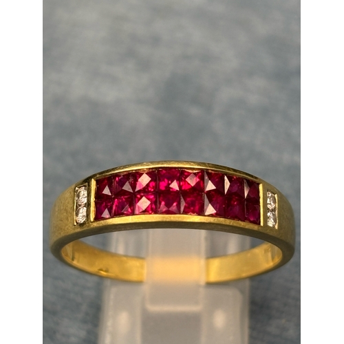 728 - Fabulous 18ct gold ladies ring set with 16 square cut rubies and 4 diamonds. Size Z. 5.3gms. An abso... 