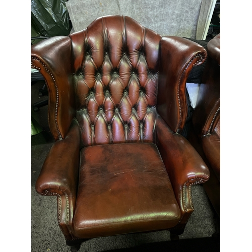 750 - Chesterfield high wing button-backed leather chair with Queen Anne legs to the fronts, in the most d... 