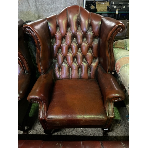 751 - Chesterfield high wing button-backed leather chair with Queen Anne legs to the fronts, in the most d... 