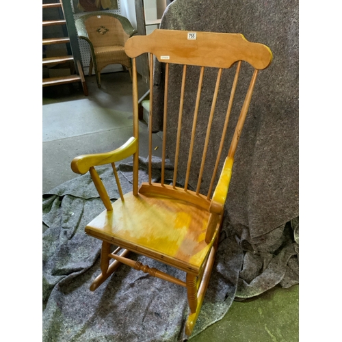 755 - Low seated wooden rocking chair in excellent order.  Timeless design.  Turned detailing to the legs ... 