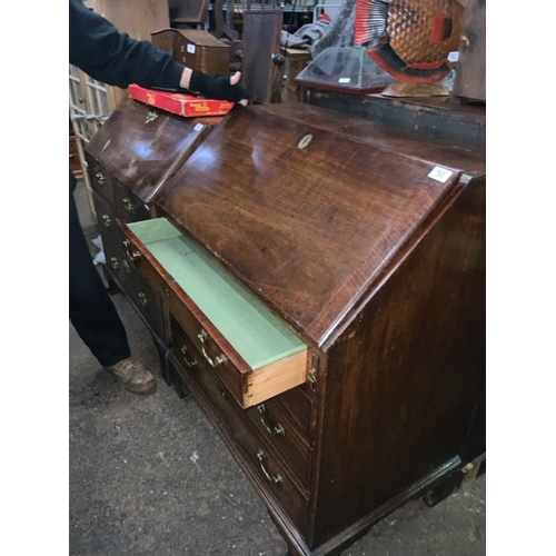 760 - Large antique mahogany bureau.  Fitted interior and key.  Brass escutcheons, locks and drop handles ... 