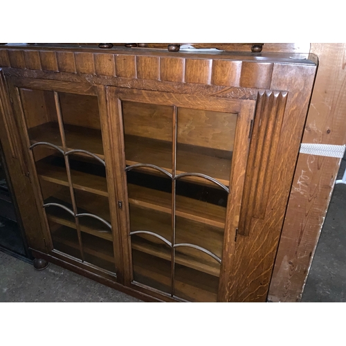 787 - Beautiful floor standing oak  bookcase with beautiful bent glass decorating glass doors and moulded ... 