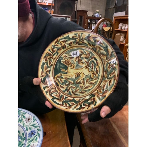 807 - Large decorative Mediterranean ware platter in ochre shades, featuring a hare. Reverse signed W34cm