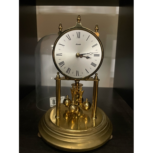 827 - Kundo glass domed brass mantle clock, approx 23cm tall