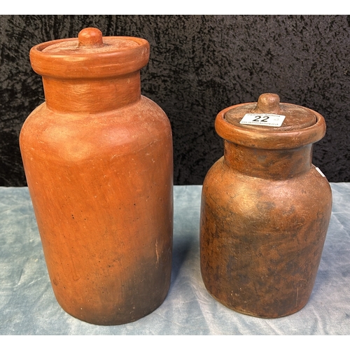 22 - Two stoneware lidded vases, approx 23cm and 31cm tall