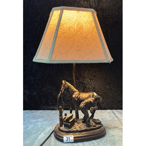 31 - Widdop, Bingham & Co. resin lamp depicting a farrier shoeing a horse (a/f damage to figure’s arm)