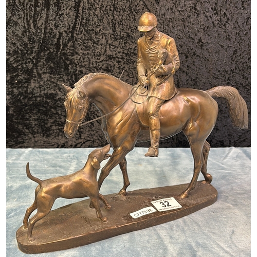 32 - Cold cast bronze sculpture depicting a hunter with hound by David Geenty (one rein needs reattaching... 