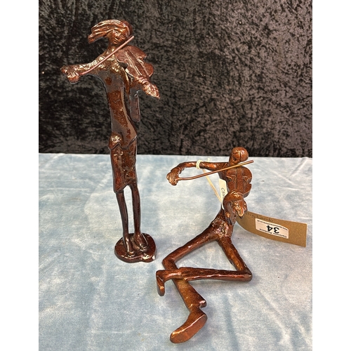 34 - Two minimalist metal figurines depicting violinists, tallest approx 25.5cm