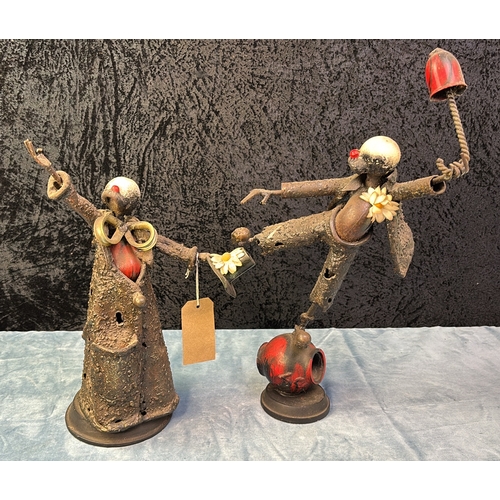 36 - Pair of heavy cast metal sculptures depicting clowns on wooden bases and signed J.C. Largest approx ... 