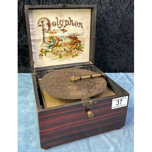 37 - Polyphon disc music box in working order with (rubbed) hand painted detail on lid. Box measures appr... 