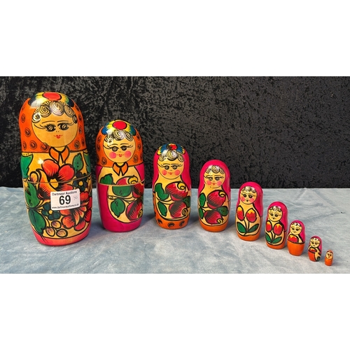 69 - Two wooden Russian Doll sets, tallest dolls are approx 20cm and 16cm tall