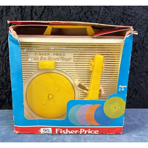 106 - Boxed Fisher Price record player (the same one Ann had when she were a nipper), a bag of marbles and... 