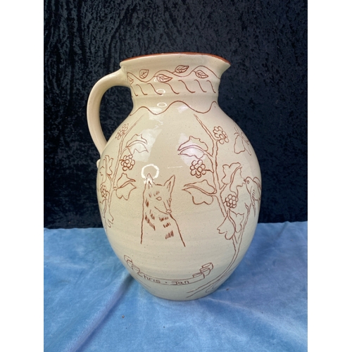 133 - A large and classic example of Colwill Pottery in the form of a large harvest jug, decorated with wo... 