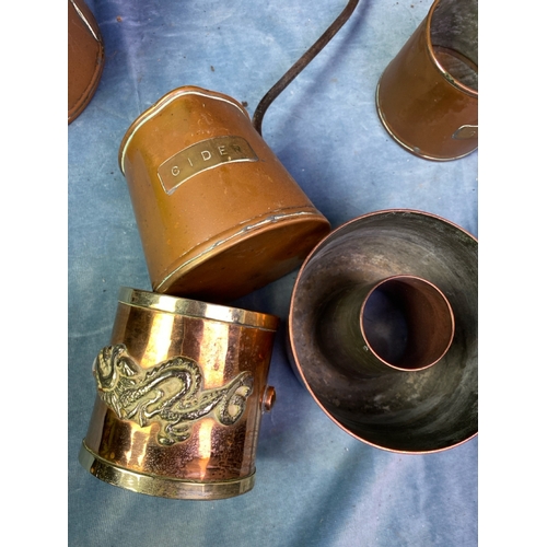 202 - A set of antique graduated copper cider measures with a copper mould and pretty brass decorated copp... 