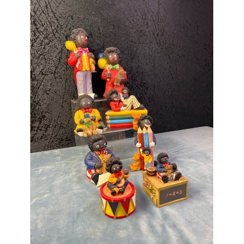 251 - Collection of 8 Golly children related figurines inc Regency Fine Arts and Shudehill