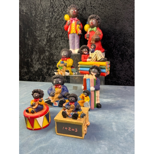 251 - Collection of 8 Golly children related figurines inc Regency Fine Arts and Shudehill