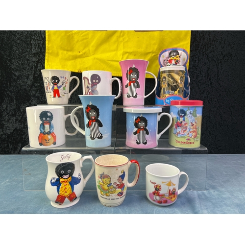 256 - Golly related mugs inc Leonardo Collection, Carlton ware and MacDonald plus a Golly tea towel