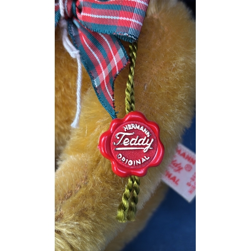 394 - Hermann golden teddy bear with original tag, mohair fur, jumped back, stitched nose and tartan ribbo... 