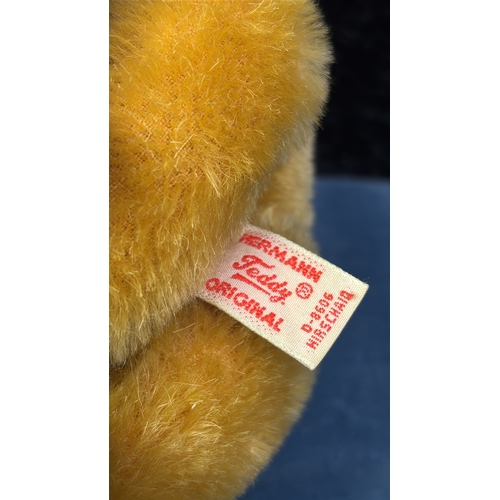 394 - Hermann golden teddy bear with original tag, mohair fur, jumped back, stitched nose and tartan ribbo... 