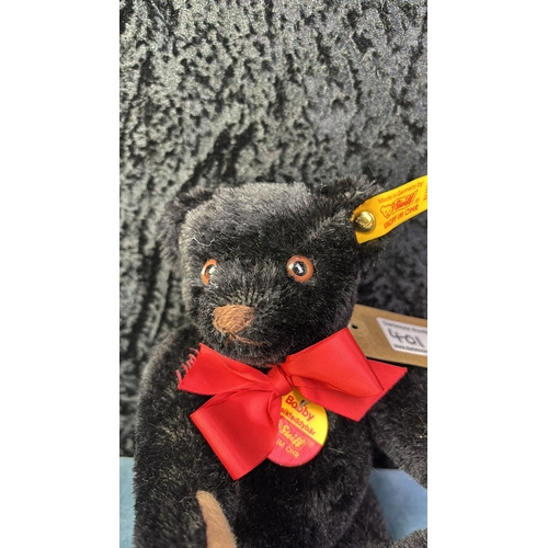 401e - Steiff Bobby musical teddy bear with guitar, black mohair fur, winds up at the back and plays a tune... 